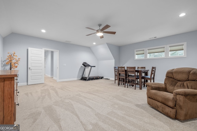 exercise area with lofted ceiling, light carpet, and ceiling fan