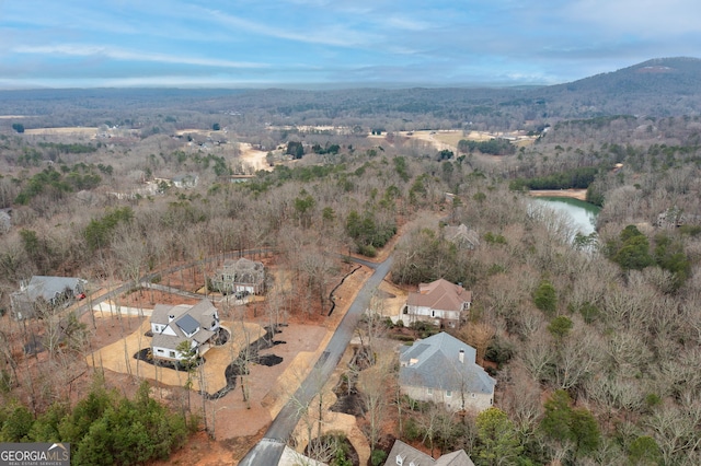 bird's eye view with a water and mountain view