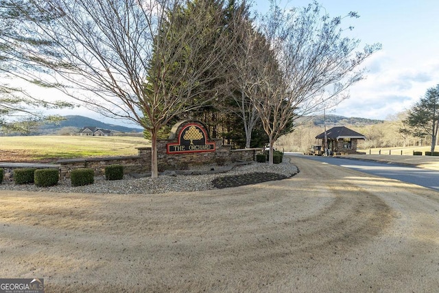 community sign featuring a mountain view