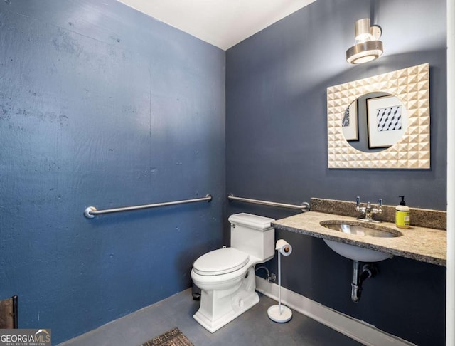 bathroom featuring toilet and sink