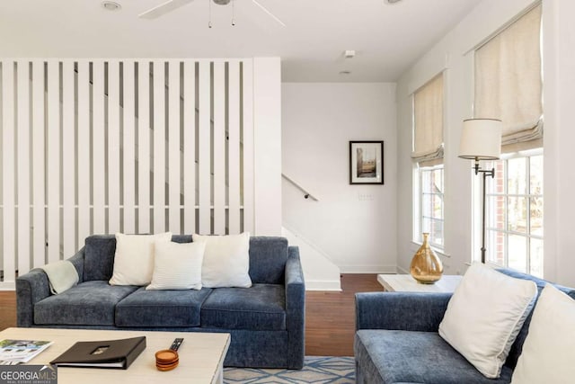 living room featuring hardwood / wood-style flooring and ceiling fan