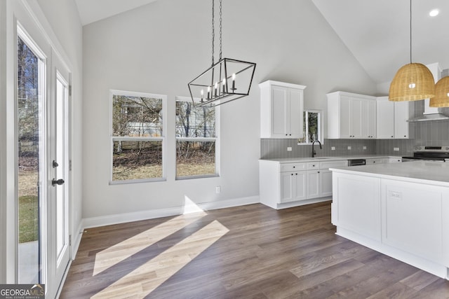 kitchen featuring white cabinetry, pendant lighting, and stainless steel range with electric cooktop