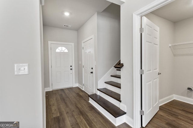 foyer with dark hardwood / wood-style floors