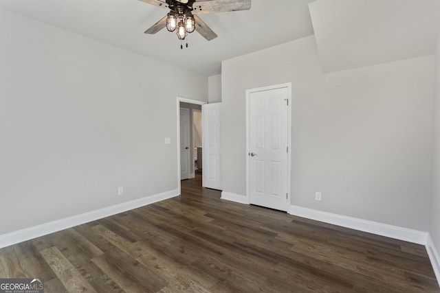 unfurnished bedroom featuring dark hardwood / wood-style flooring and ceiling fan