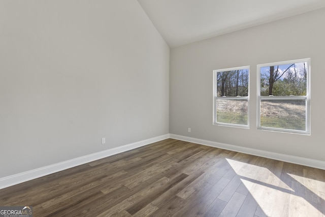 spare room featuring dark hardwood / wood-style flooring