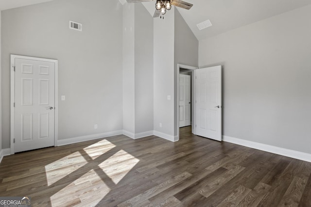 unfurnished bedroom with ceiling fan, high vaulted ceiling, and dark hardwood / wood-style flooring