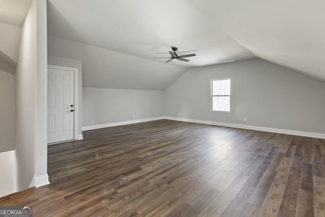 bonus room with ceiling fan, lofted ceiling, and dark hardwood / wood-style flooring