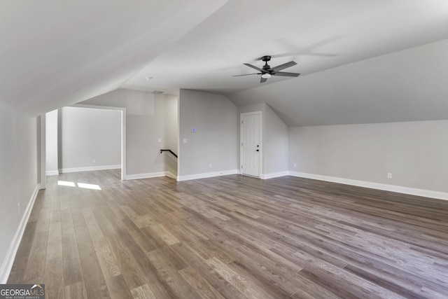 bonus room featuring hardwood / wood-style flooring, lofted ceiling, and ceiling fan