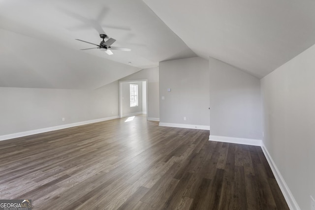 bonus room with lofted ceiling, dark hardwood / wood-style floors, and ceiling fan