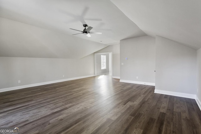 bonus room featuring dark hardwood / wood-style flooring, lofted ceiling, and ceiling fan