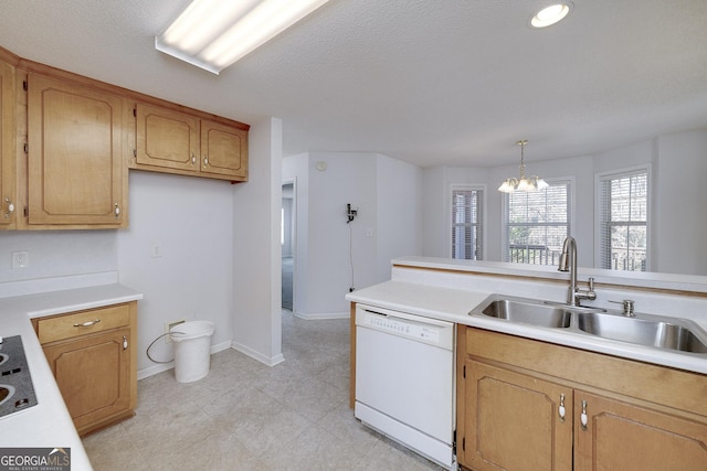 kitchen with an inviting chandelier, a sink, white dishwasher, and light countertops