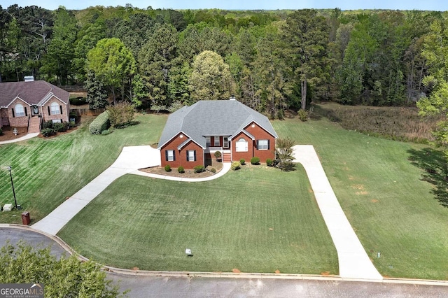 aerial view featuring a wooded view