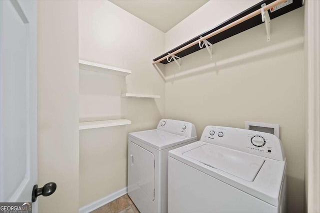 clothes washing area featuring separate washer and dryer