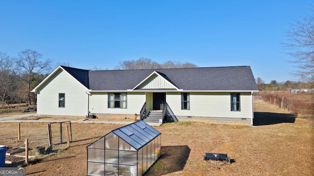 view of front of house featuring an outbuilding