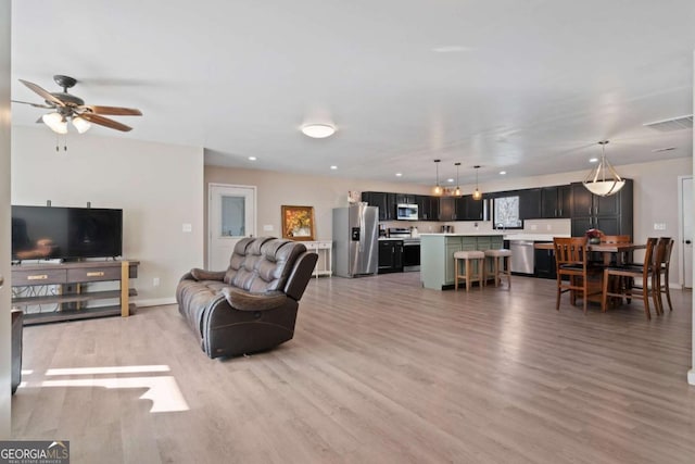 481 Fairview Rd NW, Calhoun, GA 30701 - living area featuring baseboards, wood finished floors, recessed lighting, and a ceiling fan