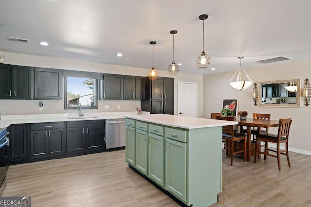 kitchen with sink, hanging light fixtures, light wood-type flooring, stainless steel dishwasher, and a kitchen island