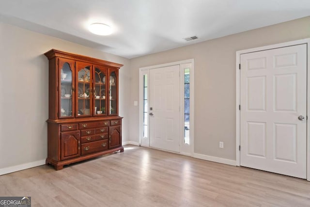 entrance foyer with light hardwood / wood-style floors