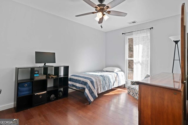 bedroom featuring dark wood-type flooring and ceiling fan