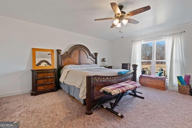 bedroom with ceiling fan and light colored carpet