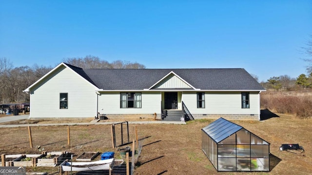 view of front of home with an outdoor structure