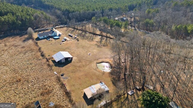 481 Fairview Rd NW, Calhoun, GA 30701 - view of front facade featuring roof with shingles, an outbuilding, a greenhouse, crawl space, and a garden