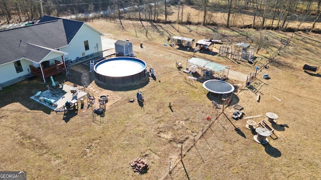 481 Fairview Rd NW, Calhoun, GA 30701 - view of front of house with entry steps, an outbuilding, a greenhouse, and a vegetable garden