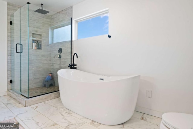 bathroom featuring toilet and shower with separate bathtub