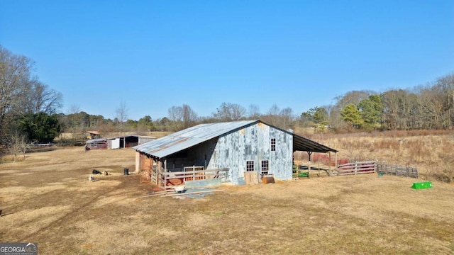 view of outbuilding with a rural view