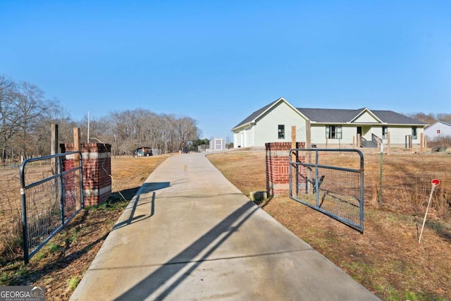 481 Fairview Rd NW, Calhoun, GA 30701 - rear view of property featuring an outdoor structure, a wooded view, and fence