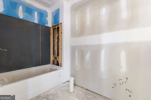 bathroom with concrete flooring