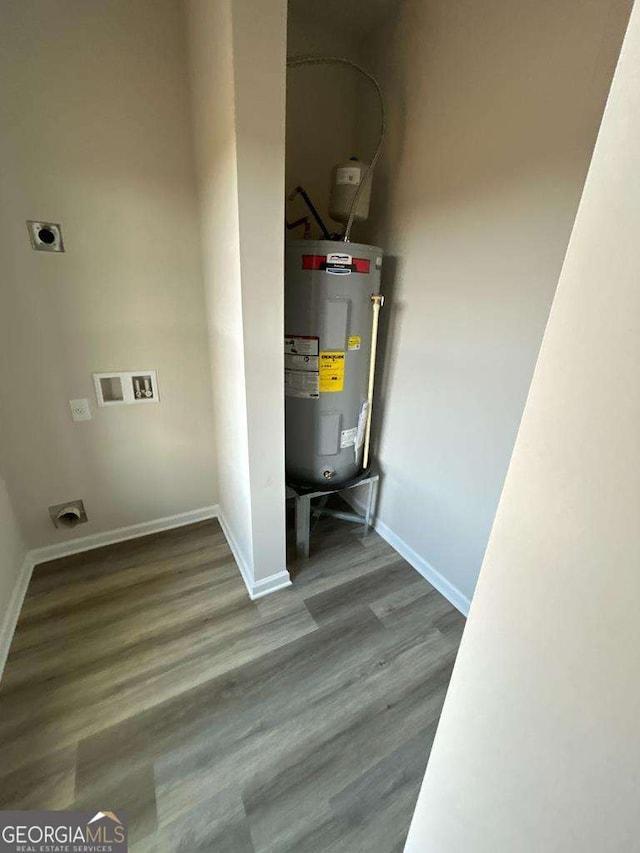 utility room featuring water heater