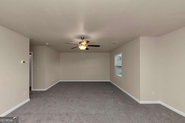 unfurnished room featuring ceiling fan, carpet, and a textured ceiling