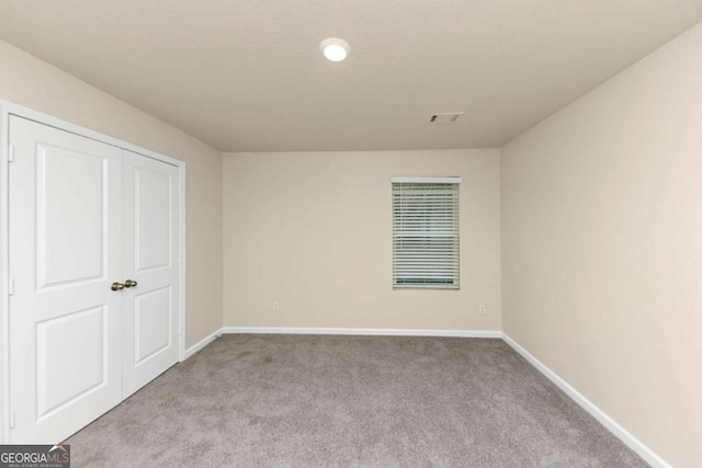 unfurnished bedroom with light carpet