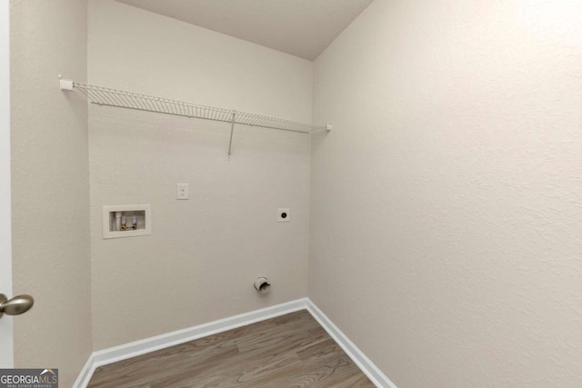 laundry room featuring hookup for a washing machine, electric dryer hookup, and hardwood / wood-style floors