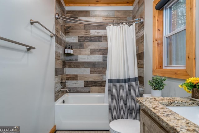 full bathroom featuring vanity, toilet, and shower / bath combo with shower curtain