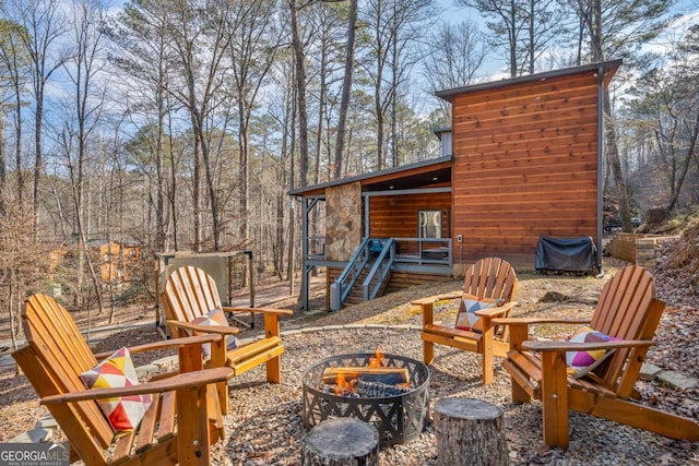 view of patio / terrace with a fire pit