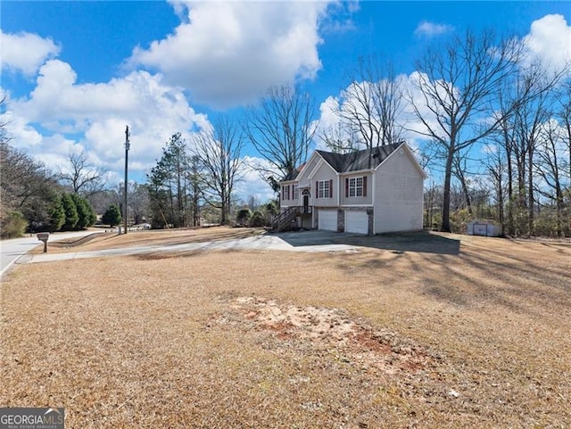 view of side of home featuring a garage