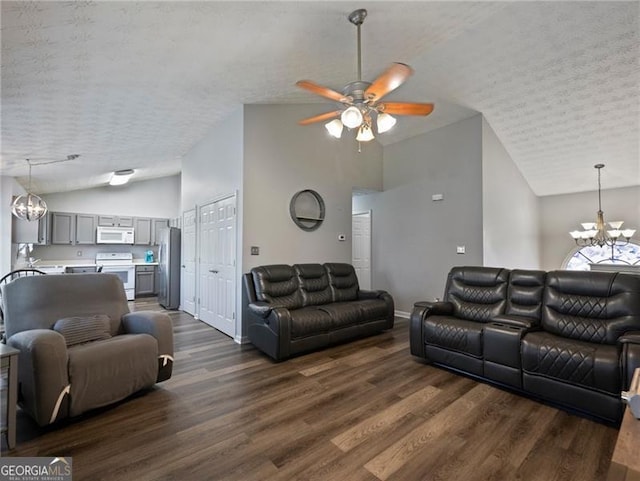 living room with high vaulted ceiling, dark hardwood / wood-style floors, ceiling fan with notable chandelier, and a textured ceiling