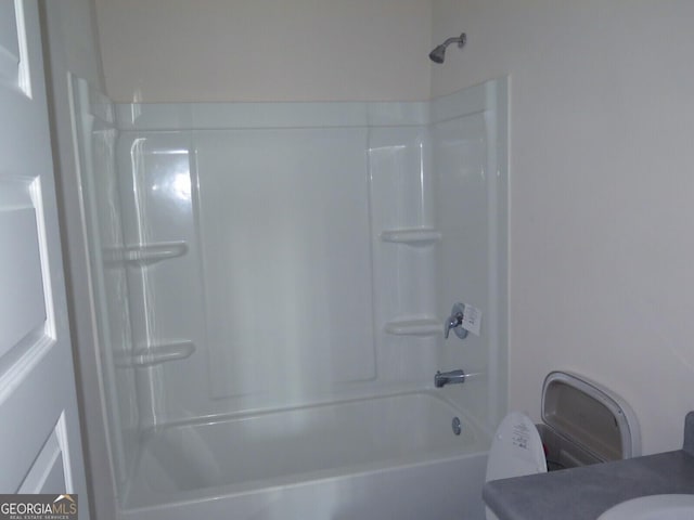 bathroom featuring vanity and washtub / shower combination