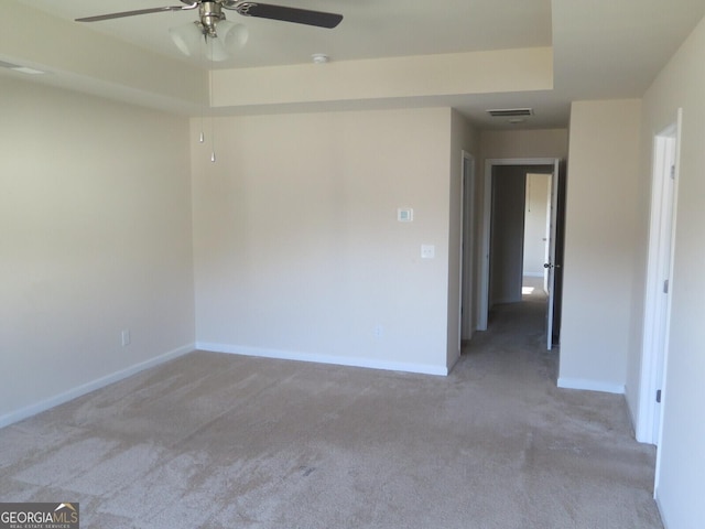 empty room with light carpet and ceiling fan