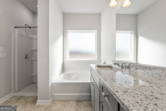 bathroom with vanity and separate shower and tub