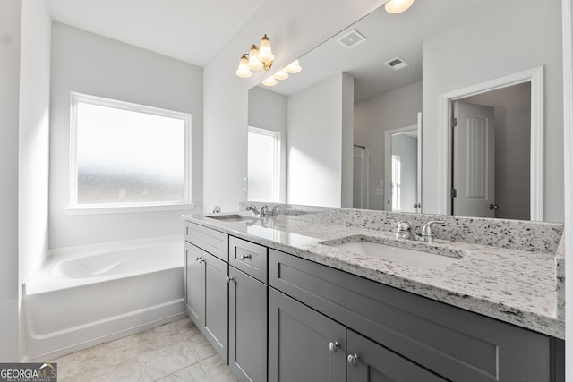 bathroom featuring vanity and a bathing tub