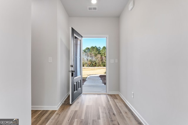 doorway with light hardwood / wood-style flooring