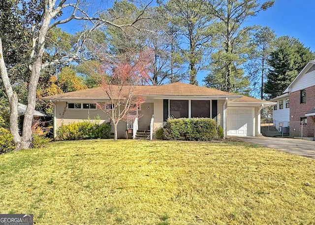 ranch-style house with a garage and a front yard