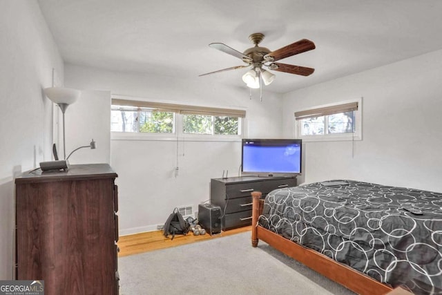 carpeted bedroom with ceiling fan