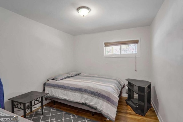 bedroom featuring dark hardwood / wood-style flooring