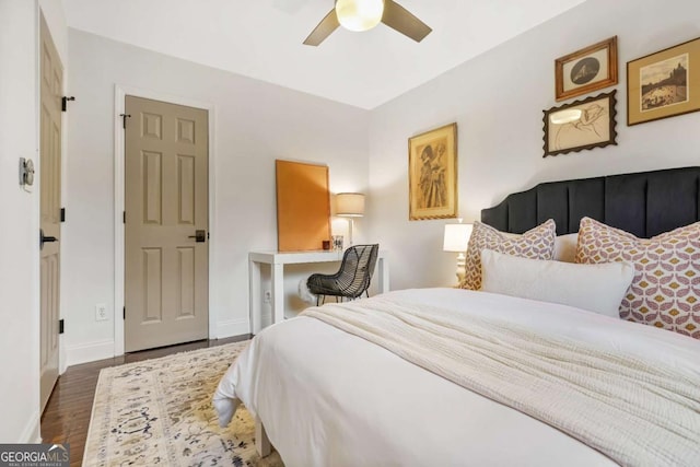 bedroom featuring dark hardwood / wood-style flooring and ceiling fan