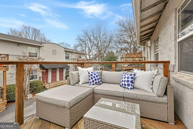 wooden deck with an outdoor hangout area