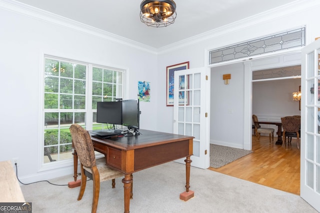 office featuring crown molding, hardwood / wood-style floors, a notable chandelier, and french doors