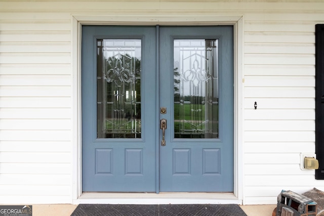 property entrance featuring french doors